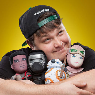 Colby Fayock hugging stuffed Star Wars toys
